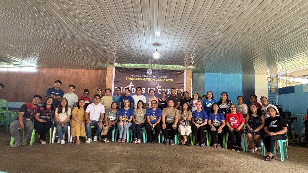 A nearly identical wide-angle group portrait of the entire assembly, capturing the scale of the "Transformation Camp 2026" gathering in Central Luzon.